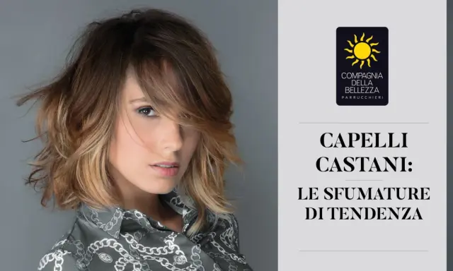 Modella con capelli castani sfumati, un esempio di tabella colori capelli castani con tonalità di tendenza.