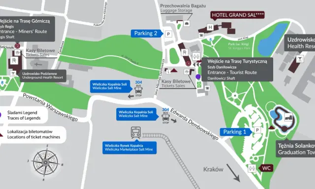 Mapa Kopalni Soli Wieliczka z zaznaczonym parkingiem, wejściami na trasy, kasami biletowymi i atrakcjami.