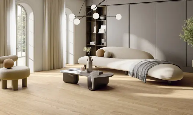 Un salotto in stile scandinavo casa con divano curvo, poltrona soffice, tavolino moderno e un'elegante lampada a sospensione.