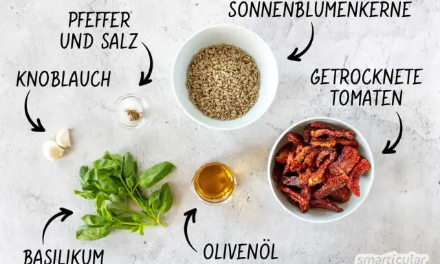 Zutaten für leckere Pesto Rezepte: Basilikum, Knoblauch, Sonnenblumenkerne, getrocknete Tomaten, Olivenöl, Pfeffer und Salz.