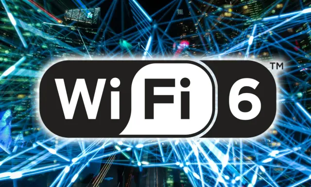 Logo Wi-Fi 6 na tle sieci światłowodów i miasta nocą.