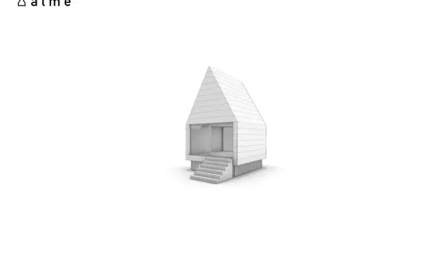 Ein modernes frame haus mit Stufen und großen Fenstern.
