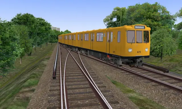 Żółty tramwaj jedzie po torach, otoczony zielenią. Sprawdź, czy Twój komputer spełnia omsi 2 wymagania, by cieszyć się taką grafiką.