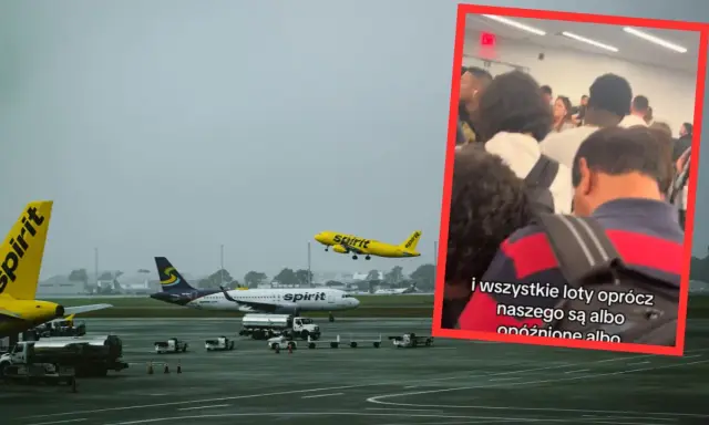 Spirit Airlines, znane jako najgorsze linie lotnicze, na lotnisku. Samoloty na płycie i w powietrzu. W tle tłum pasażerów.
