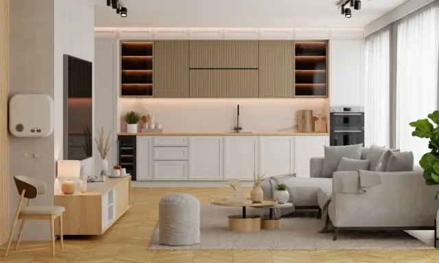 Mały salon z kuchnią aranżacje: jasne meble, szara sofa, drewniane akcenty i nowoczesne oświetlenie tworzą przytulną przestrzeń.