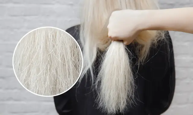 Domowe sposoby na suche włosy po rozjaśnianiu. Zbliżenie na zniszczone, blond włosy, które potrzebują nawilżenia.