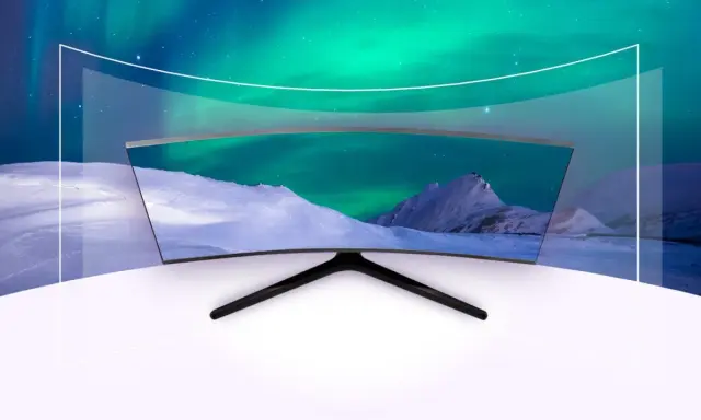 Zakrzywiony ekran Samsunga wyświetla zorzę polarną nad ośnieżonymi górami, tworząc wciągające wrażenia wizualne.