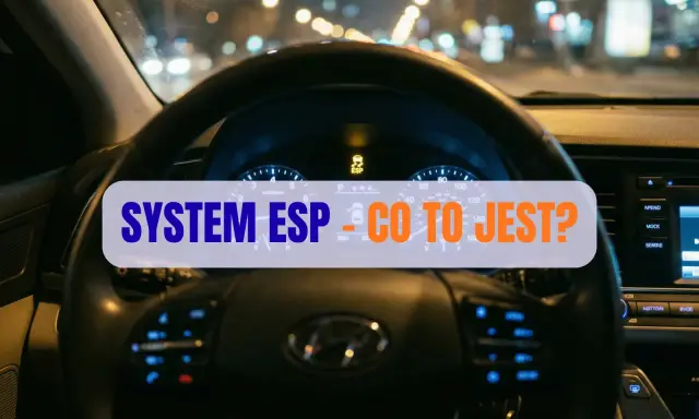 Widok na deskę rozdzielczą samochodu nocą. Na ekranie świeci się kontrolka ESP, a na kierownicy napis "SYSTEM ESP - CO TO JEST?".