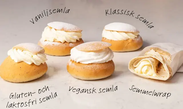 Fem olika semlor och en semmelwrap på ett marmorbord. Perfekt för semlor dagen!