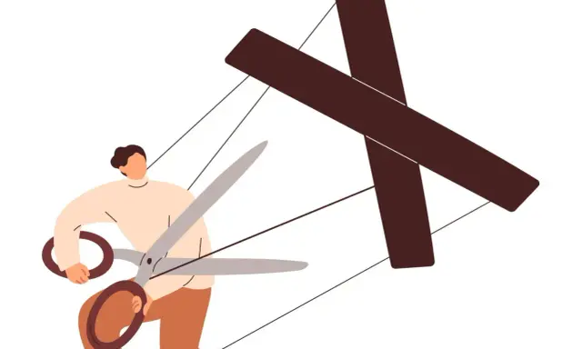 Persona con forbici taglia i fili di un burattino a forma di croce, simboleggiando come destabilizzare un manipolatore.