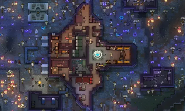Kolonia w grze podobnej do Rimworld. Koloniści budują bazę wśród świecących grzybów i niebieskich roślin.