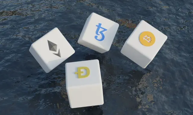Kostki z symbolami kryptowalut (Bitcoin, Ethereum, Dogecoin, Tezos) unoszą się na wodzie, symbolizując zmienność i potencjał technologii block chain.