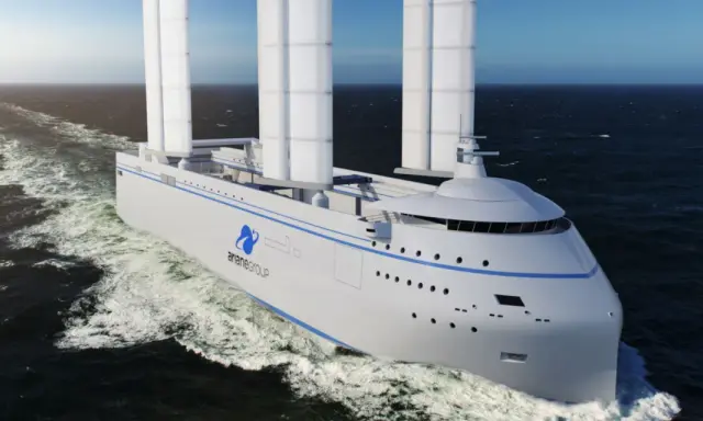 Bateau futuriste avec une canopée de voiles, naviguant sur une mer agitée.