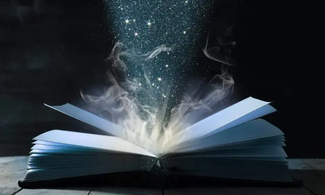 Otwarta księga, z której wydobywa się magiczny pył i dym, niczym zaklęcia z Harry'ego Pottera.