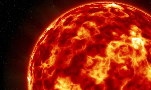 Żarząca się powierzchnia Słońca, z widocznymi plamami i rozbłyskami, zapowiada potężną burzę magnetyczną skutki.