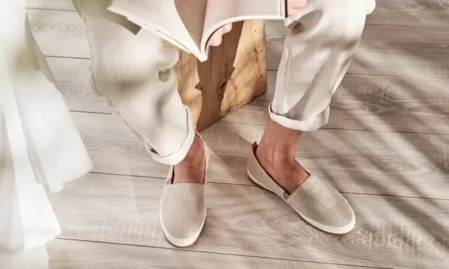 Relaxed linen pants and espadrilles in style, perfect for a casual day reading.