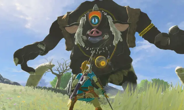 Link z gry Zelda Breath of the Wild staje naprzeciw gigantycznego Guardian'a na tle błękitnego nieba.