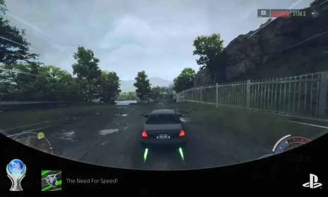 Trofea NFS Unbound zdobyte! Widok z gry na samochód jadący po mokrej drodze, z zielonymi płomieniami z wydechu.