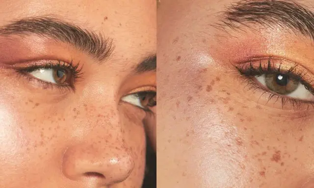 El iluminador se pone después del maquillaje para un brillo natural. Rostro con pecas y maquillaje de ojos cálido.