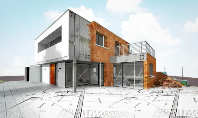 Nowoczesny dom w budowie, z cegły i betonu, na tle planów architektonicznych. Od czego zacząć budowę domu? Od projektu!
