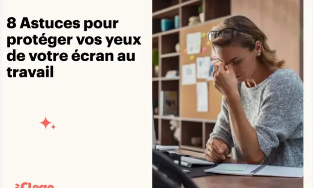 Une femme fatiguée se masse les yeux devant son ordinateur. Apprenez comment diminuer la luminosité d'un ordinateur pour protéger votre vue.