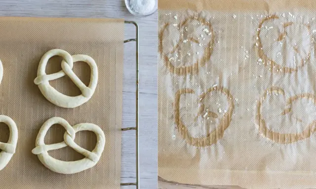 Rohe und gebackene Brezeln auf Backpapier. Links ungeborene, rechts bereits gebackene Brezeln, die zeigen, wie sie aufbacken.