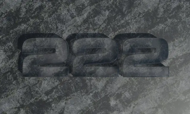 Trzy przezroczyste cyfry 2, ułożone obok siebie na kamiennym tle. Liczba 222 ma głębokie znaczenie.