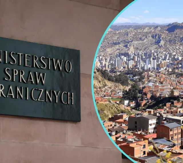 Tablica "Ministerstwo Spraw Zagranicznych" obok panoramy miasta, gdzie nie jechać.