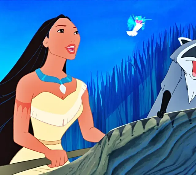 Pocahontas i jej przyjaciel Meeko w łodzi, jak w klasycznych bajkach Disneya. Kolorowy ptak lata nad nimi.