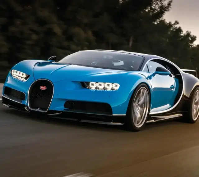 Niebieski Bugatti Chiron pędzi po drodze. Jego cena jest astronomiczna, ale wrażenia z jazdy bezcenne.