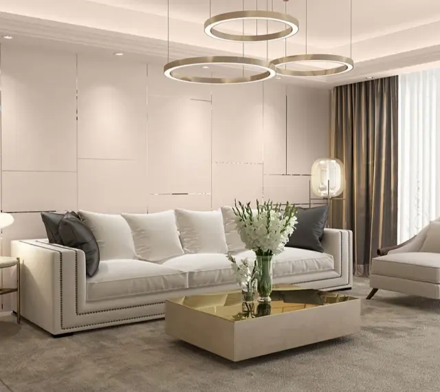Elegancki salon w stylu art deco z białą sofą, złotym stolikiem kawowym i designerskimi lampami.