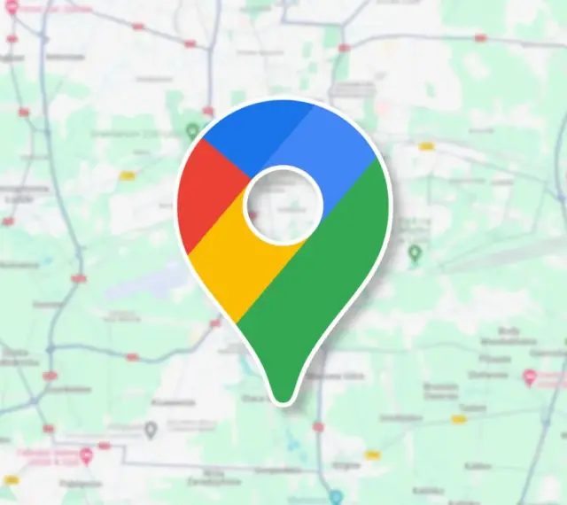 Ikona Google Maps na tle mapy. To narzędzie, które pozwala śledzić google maps historia podróży i odkrywać nowe miejsca.