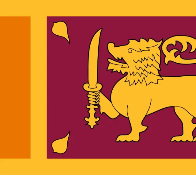 Flaga Sri Lanki z lwem i mieczem. Planujesz podróż? Sprawdź, czy potrzebna jest wiza Sri Lanka.