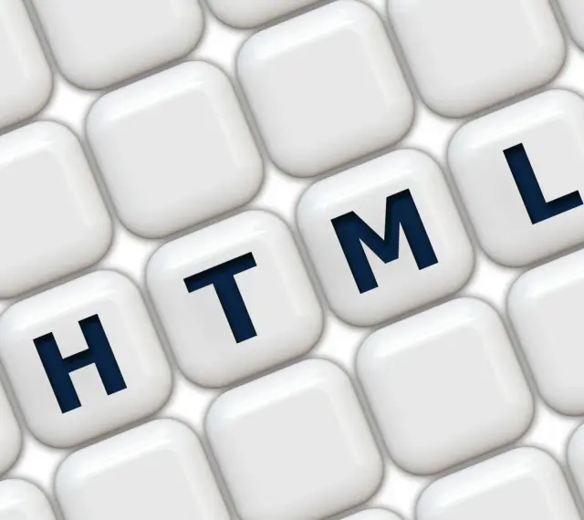 Klawisze z literami H, T, M, L układają się w słowo HTML, symbolizując podstawy programowania.