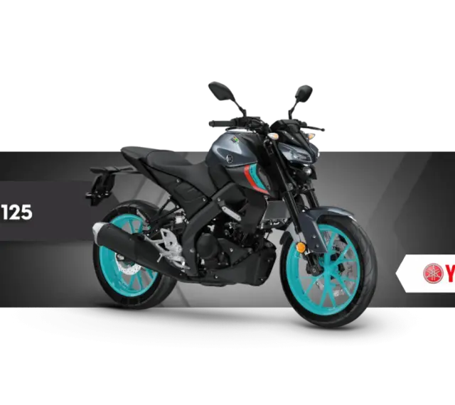 Szary motocykl Yamaha MT-125 z turkusowymi felgami, gotowy na miejskie przygody.