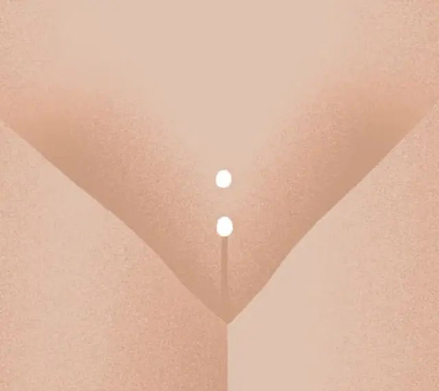 Dwa białe koraliki zdobiące Christina piercing.