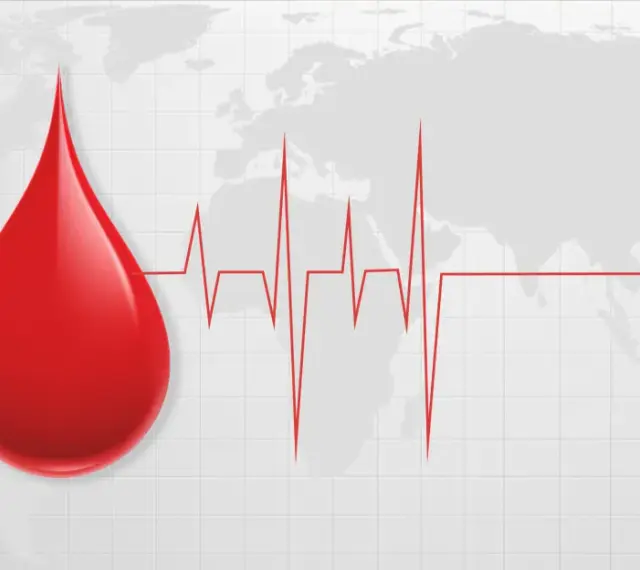 Kropla krwi na tle mapy świata i EKG. Symbolizuje unikalność i wartość każdej kropli, nawet najrzadsza grupa krwi jest cenna.