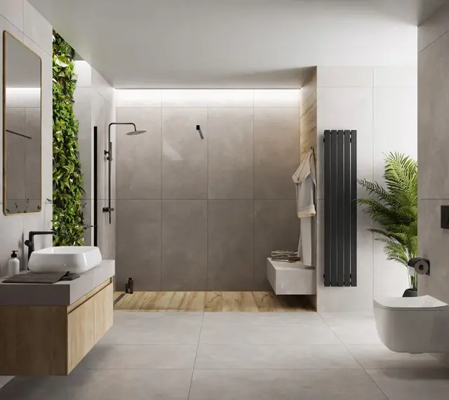 Nowoczesna łazienka z zieloną ścianą i betonem architektonicznym. Mikrocement na płytki nadaje jej surowego, ale eleganckiego charakteru.