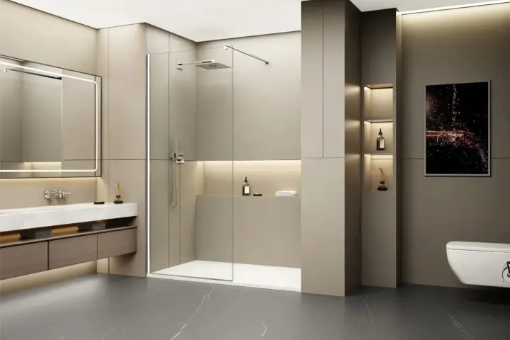 Salle de bain moderne avec un grand miroir lumineux, un lavabo suspendu et une douche à l'italienne. Le ressaut douche est discret, intégré au design épuré.