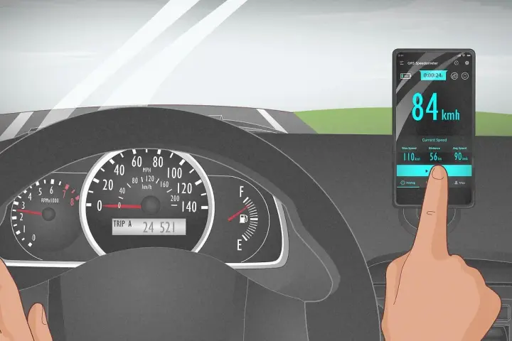A finger touches a phone displaying a GPS speedometer showing 84 km/h, as the car's own speedometer is not working.