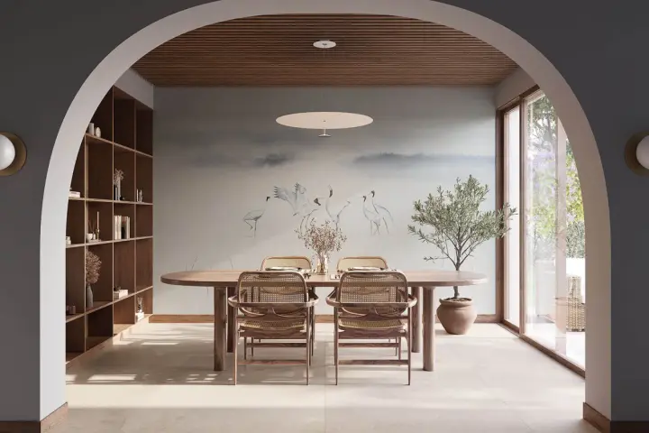Comedor con mural de grullas y árbol de olivo, creando un ambiente de feng shui sereno y natural.