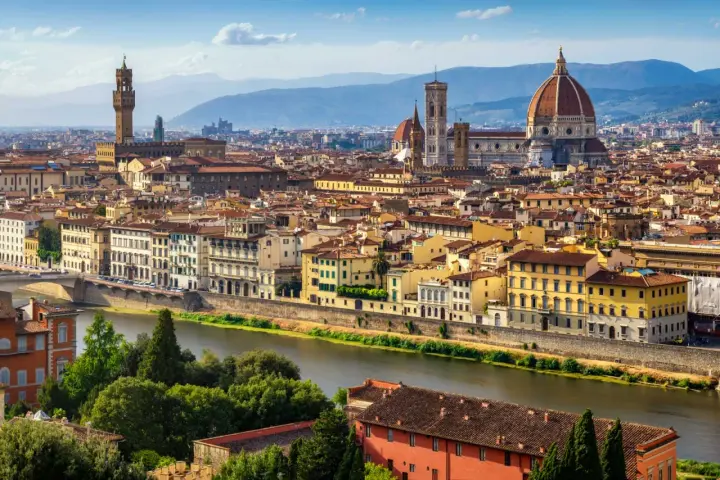 Florence skyline with the Arno River, featuring the Duomo and Palazzo Vecchio, iconic landmarks near the Uffizi Gallery and Accademia.
