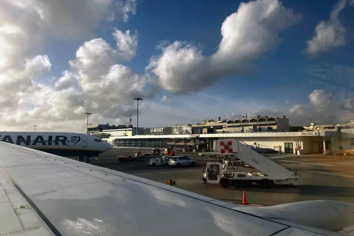 Pisa International Airport, the closest airport to Cinque Terre, with a Ryanair plane on the tarmac.