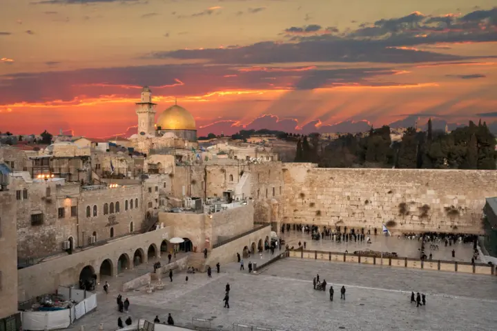 Sunset over Jerusalem's Old City, with the Dome of the Rock and the Western Wall, a glimpse of Solomon's Temple today.