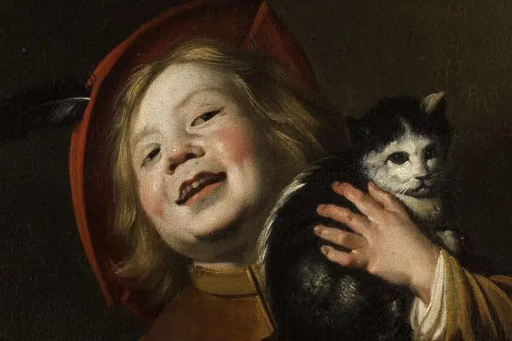 Dziecko w czerwonym kapeluszu z piórkiem, trzymające czarno-białego kota. Obraz Judith Leyster.