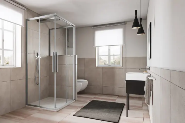 Box doccia angolare moderno con ante scorrevoli in vetro trasparente, che mostra le sue dimensioni ideali per un bagno spazioso.
