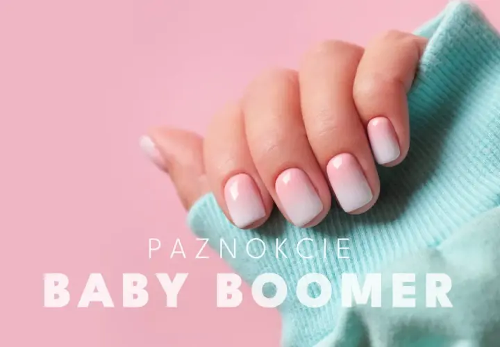 Dłoń z paznokciami w stylu baby boomer, delikatny gradient różu i bieli. Idealny manicure dla każdej kobiety.