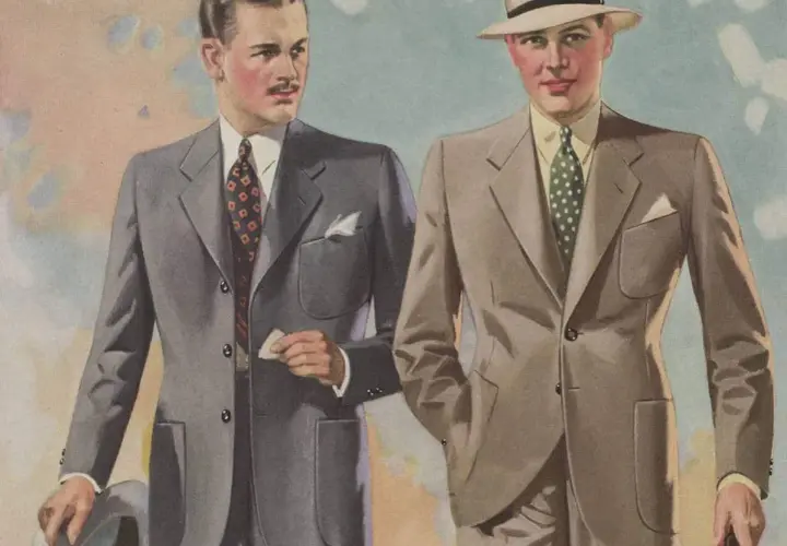 Två män i stilfulla kostymer, en med hatt, visar upp mode från 30-talet.