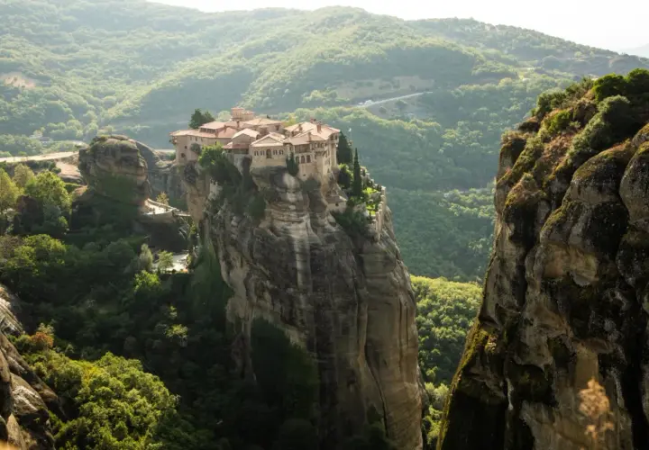 A breathtaking view of the Meteora monasteries perched atop towering rock formations, a must-see for any Greece meteora guide.