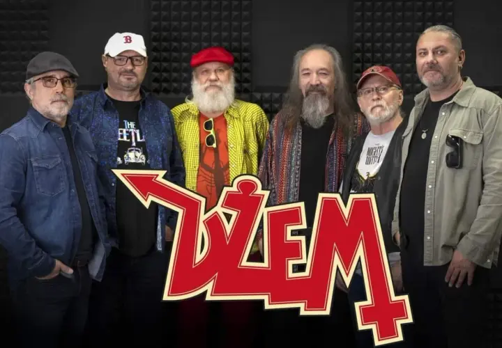 Sześciu mężczyzn, skład zespołu Dżem, pozuje do zdjęcia. W tle czerwone logo zespołu.